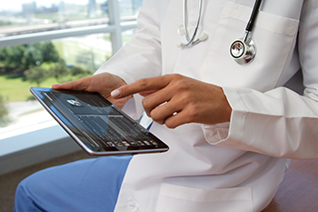 Doctor performing checkup with health insurance