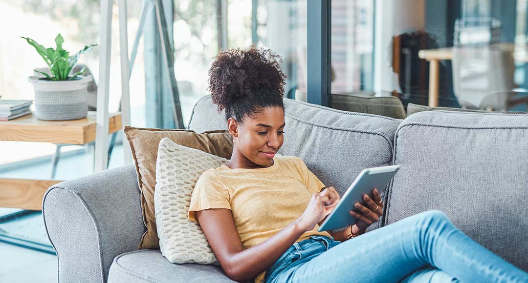 woman reading on tablet