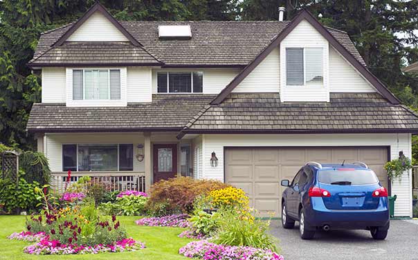 Big house car parked in driveway