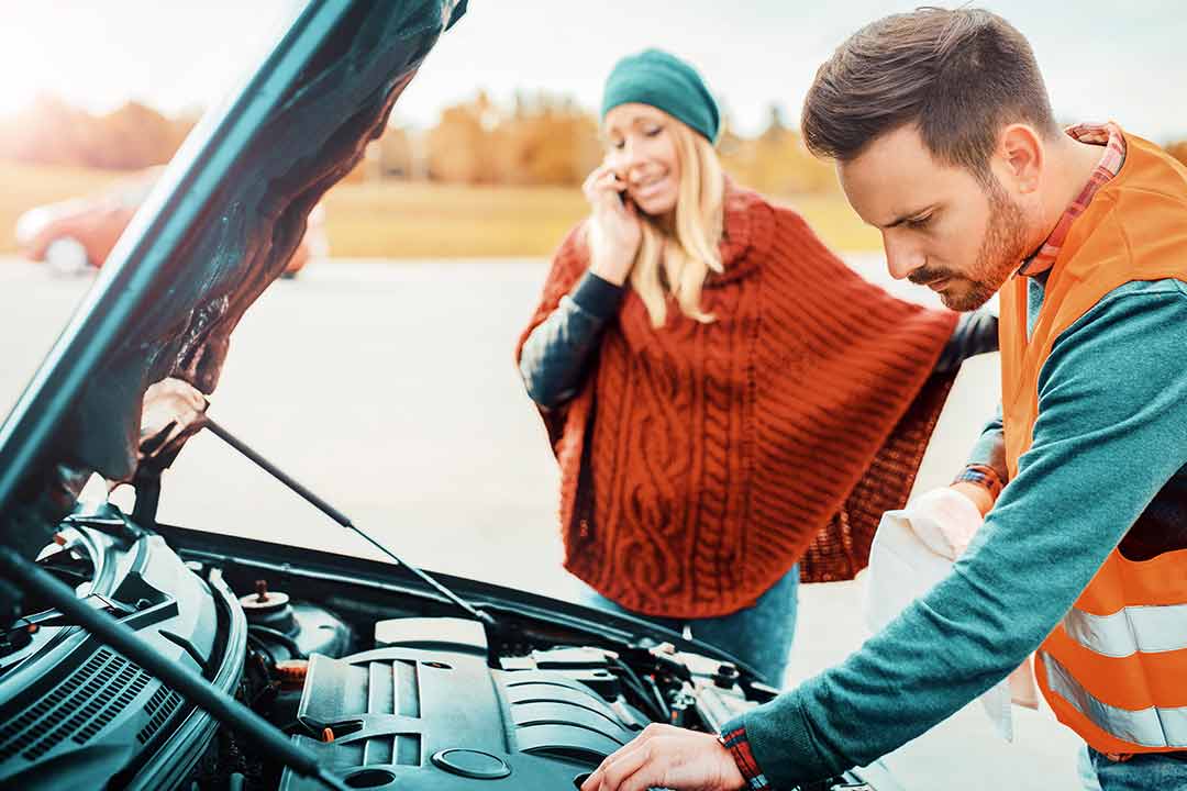 woman with broken down car