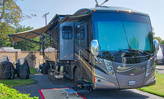 A class a motorhome parked and set up at camp