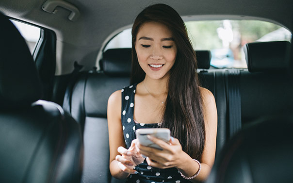 woman looking at car insurance app